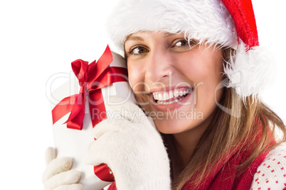 Portrait of smiling young woman holding gift