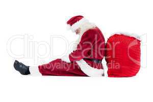 Santa sits leaned on his bag