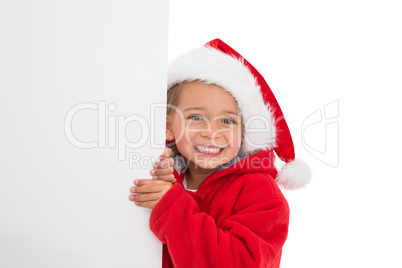 Festive little girl showing poster