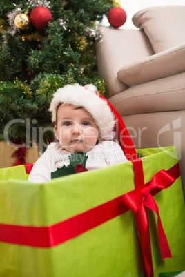 Cute baby boy in large christmas present