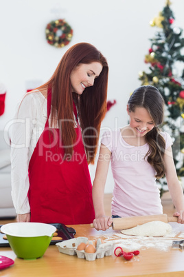 Festive mother and daughter baking together