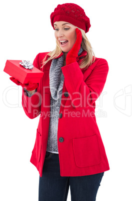 Festive blonde holding red gift