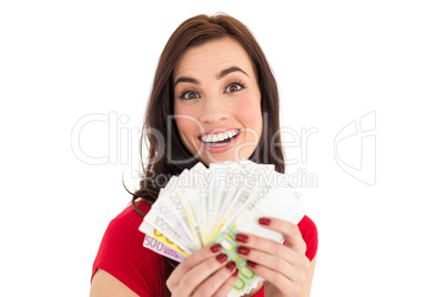 Pretty brunette holding her cash