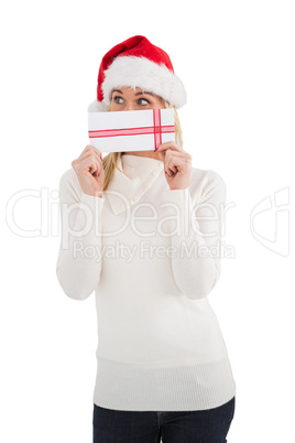 Festive blonde holding a gift