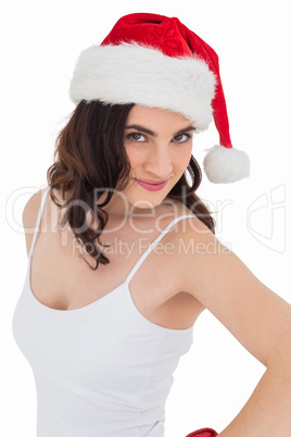 Portrait of a pretty brunette in santa hat