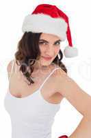 Portrait of a pretty brunette in santa hat