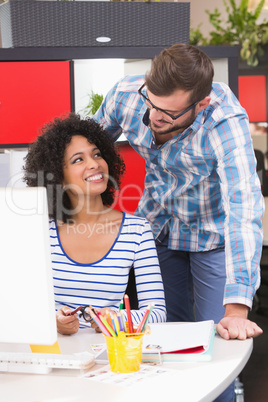 Photo editors using computer in office