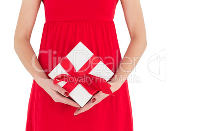 Woman in red dress holding gift