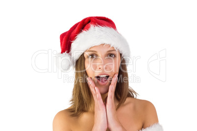 Pretty santa girl with hands on face