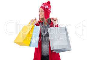 Blonde in winter clothes holding shopping bags