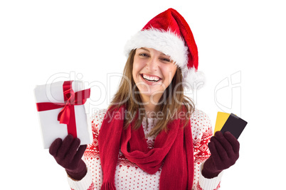 Smiling young brunette with gift and credit card