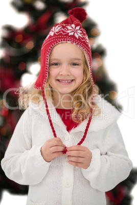 Festive little girl in hat and scarf