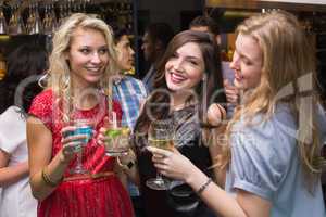 Happy friends having a drink together