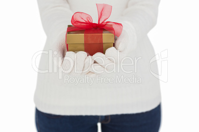 Woman in white gloves holding gift