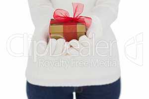 Woman in white gloves holding gift