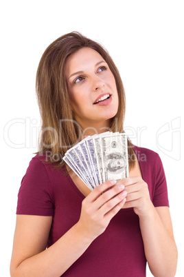 Festive brunette holding her cash