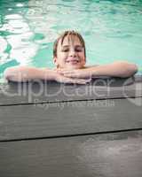 Little boy smiling in the pool