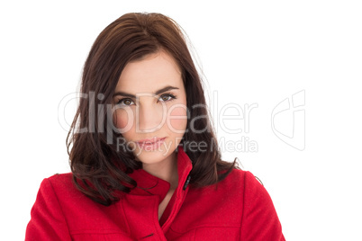 Portrait of a beautiful brunette in red coat