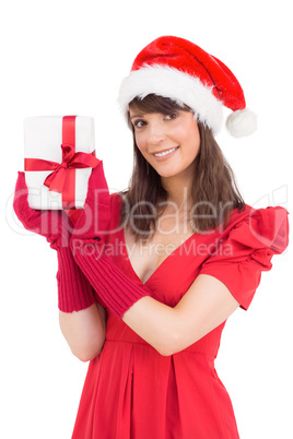 Cute brunette holding a gift