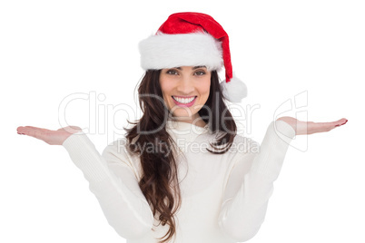 Festive brunette holding hands out