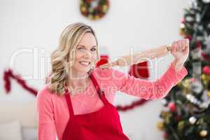 Festive blonde making christmas cookies