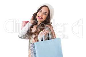 Smiling brown hair posing with shopping bags