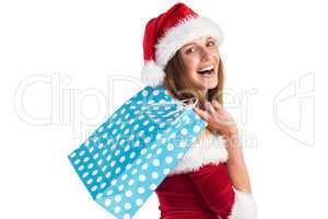 Festive brunette holding shopping bags