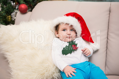 Cute baby boy on couch at christmas