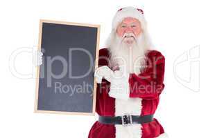 Santa holds a black board
