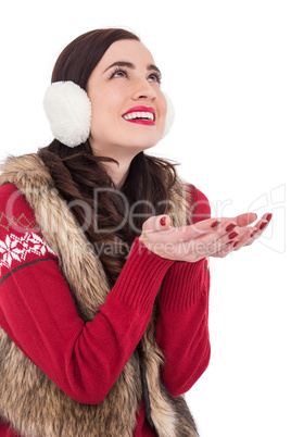 Brunette in winter clothes with hands out