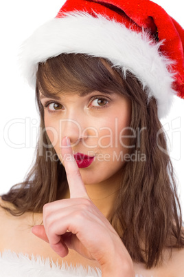 Festive brunette keeping a secret