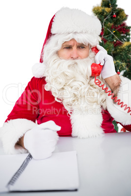 Annoyed santa claus on the phone