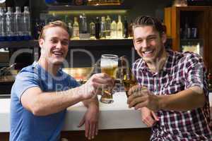 Young men drinking beer together