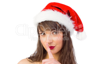 Festive brunette keeping a secret