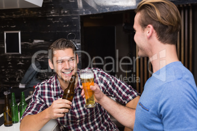 Young men drinking beer together