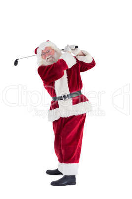 Santa Claus swings his golf club