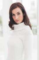 Pretty brunette in white jumper posing