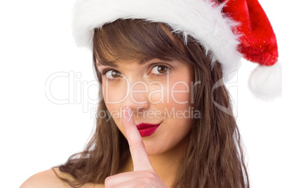 Festive brunette keeping a secret