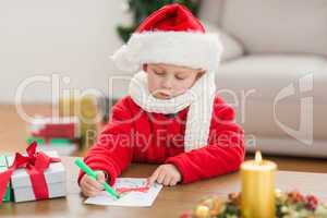 Festive little boy drawing pictures