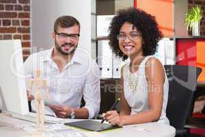 Smiling photo editors in office