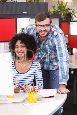 Photo editors using computer in office