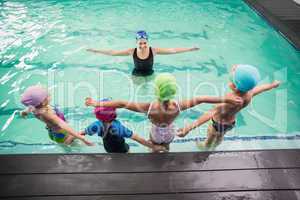 Cute swimming class watching the coach