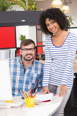 Photo editors using computer in office