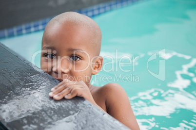 Cute little boy smiling in the pool