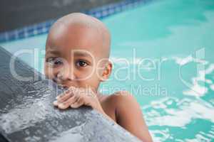 Cute little boy smiling in the pool