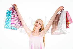 Pretty young blonde holding shopping bags