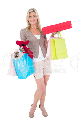 Happy blonde with shopping bags and gifts