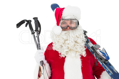 Happy santa posing with ski and ski poles