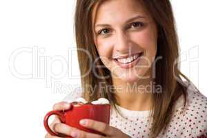 Cheerful cute brunette sitting on couch holding mug