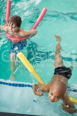 Little boys swimming in the pool